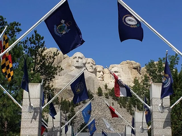 Mount Rushmore framed by state flags at the Avenue of Flags